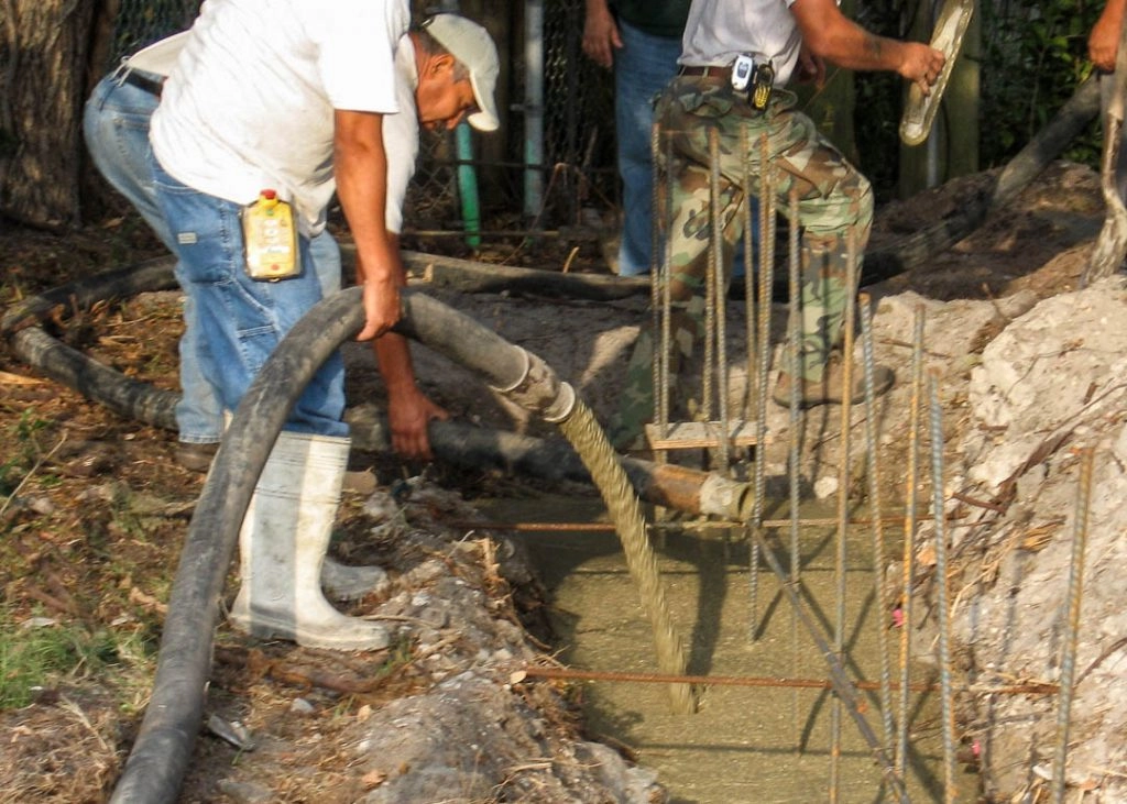 Concrete pump truck placing concrete